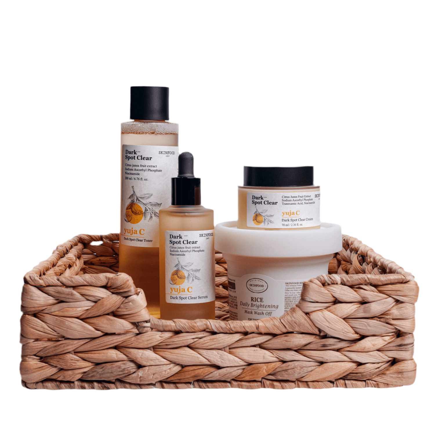 Dark Spot Removal Set 4 displayed in a woven basket featuring skincare products for brightening and dark spot treatment.